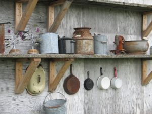 Old Cookware hanging up on a wall